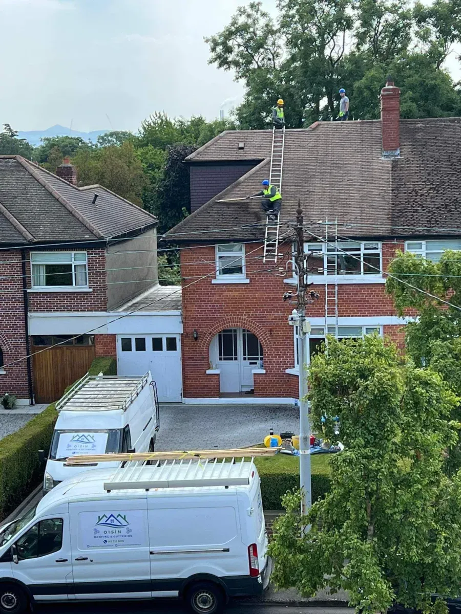Oisin Roofing van and ladder outside a Dublin house
